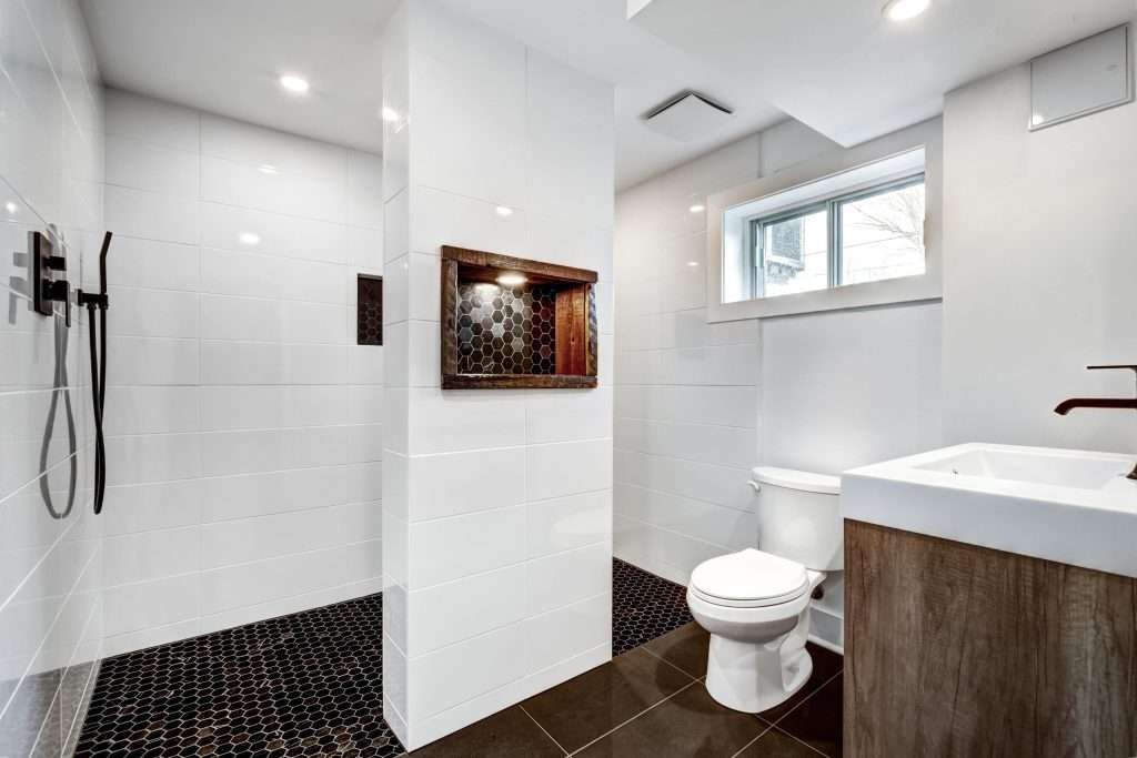 Typical budget Canadian single family house, renovated with some luxury elements in design partially furnished with kitchen, rooms, bedrooms, appliances, finished basement, laundry, backyard and patio svg+xml;charset=utf